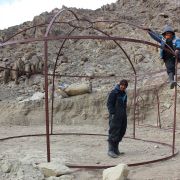Setting up the dome and tunnel framework... Stanzin Shara and Dadul.