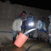 Finally stream water reaches the stupa site. Ice Stupa team measures the discharge.